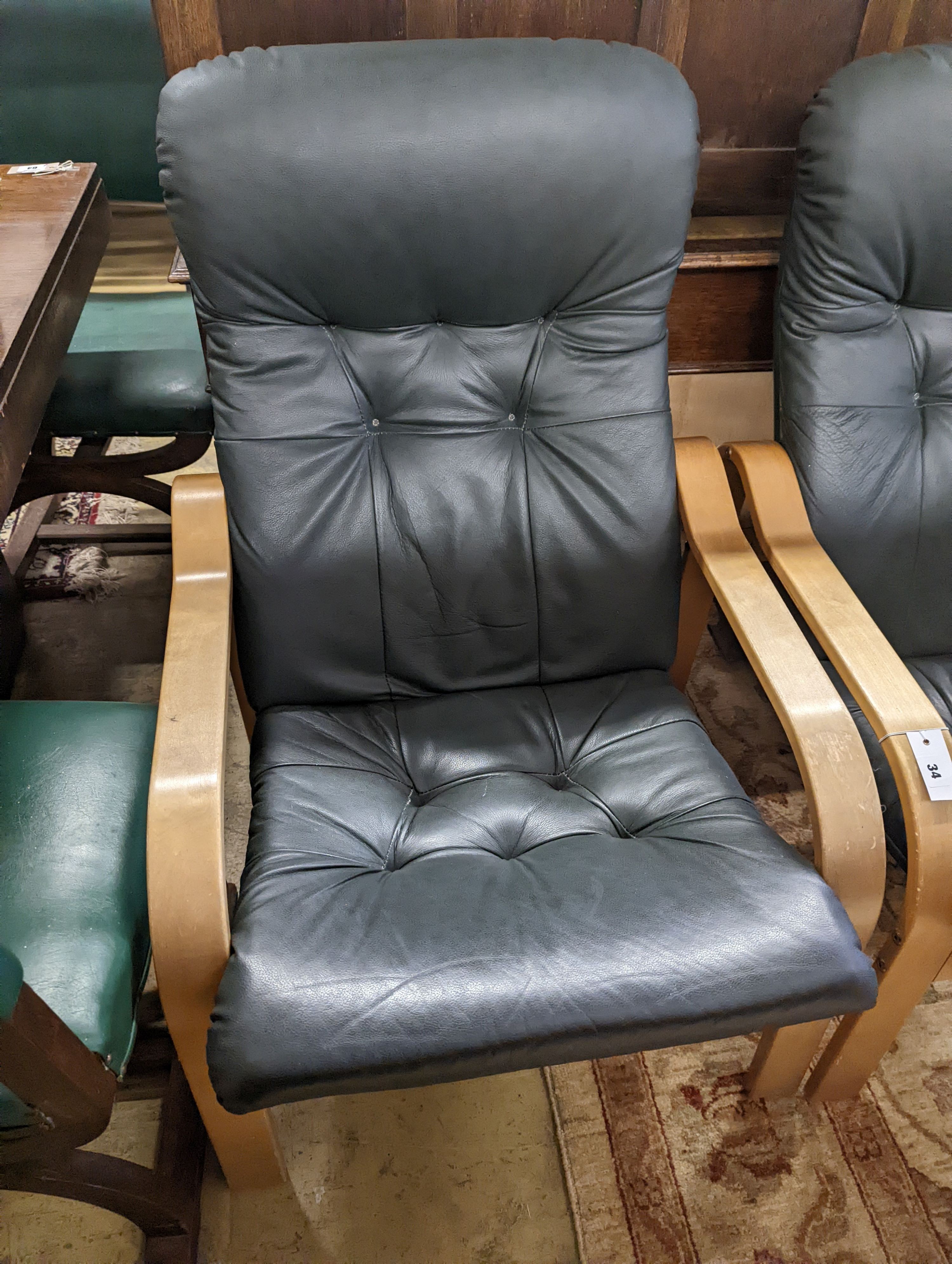 A pair of mid century Norwegian green leather and bent ply armchairs, width 68cm, depth 80cm, height 96cm